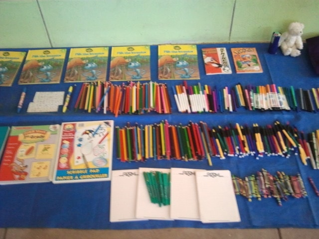 With great enthusiasm children in this remote Andean village receive our gift of school supplies and toys.
