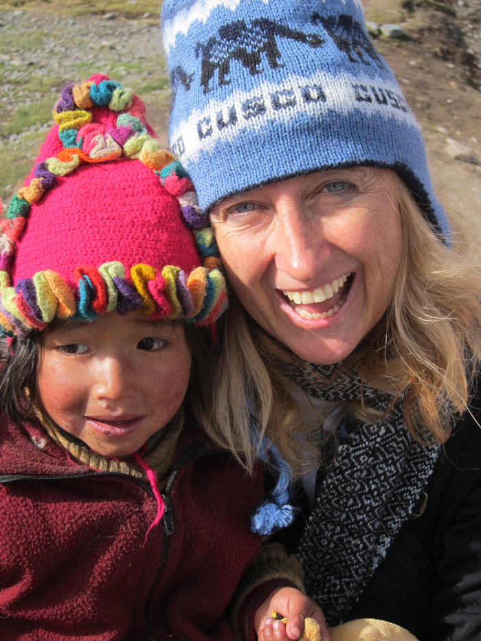 Our Founder Linda Slade with local child.